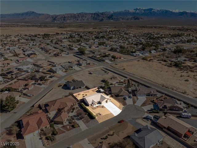 drone / aerial view with a residential view and a mountain view