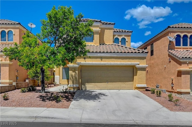 mediterranean / spanish-style house with a tile roof, driveway, and stucco siding