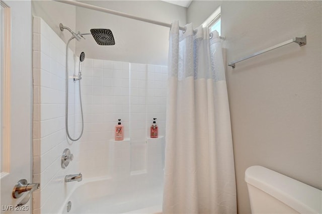 bathroom with shower / tub combo and toilet