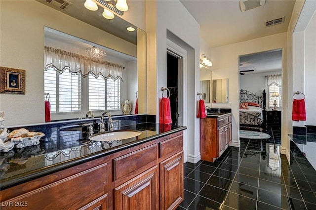 full bathroom featuring vanity, tile patterned floors, visible vents, and ensuite bathroom