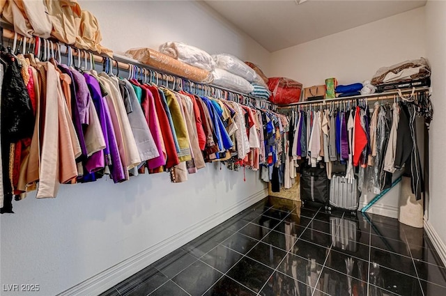 spacious closet featuring tile patterned flooring