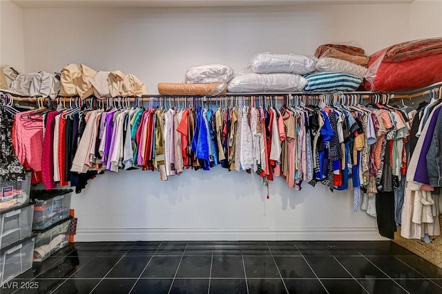 walk in closet with tile patterned flooring