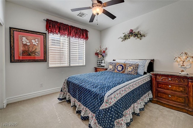 bedroom featuring visible vents, baseboards, carpet, and a ceiling fan