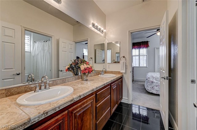 ensuite bathroom featuring tile patterned floors, double vanity, ensuite bathroom, and a sink