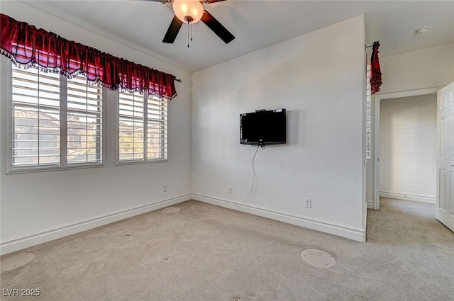 unfurnished living room featuring baseboards, carpet, and ceiling fan