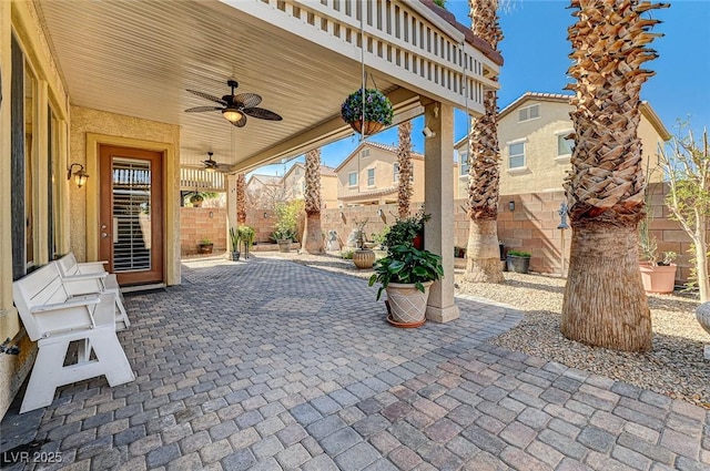 view of patio featuring a ceiling fan and a fenced backyard