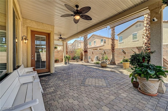 view of patio / terrace with fence and ceiling fan