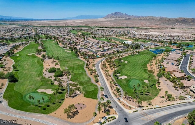 aerial view with golf course view and a mountain view