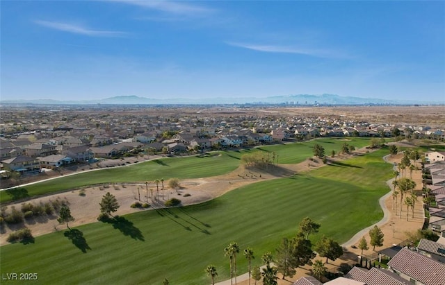 aerial view with a mountain view, a residential view, and golf course view