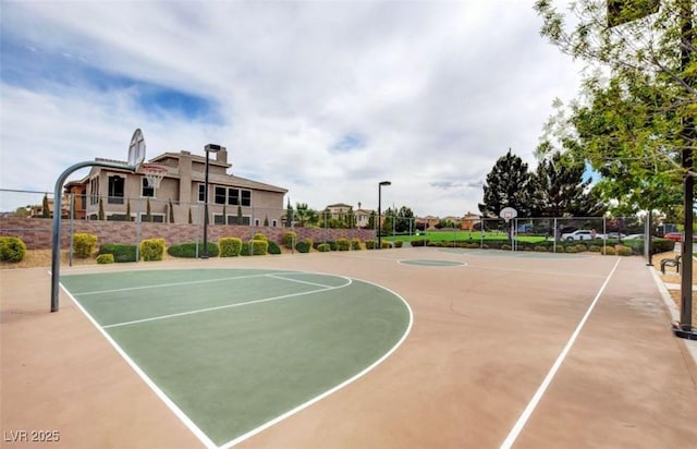 view of sport court with community basketball court and fence