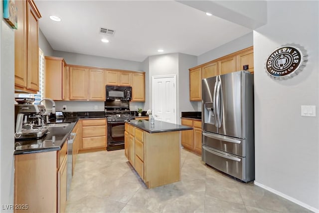 kitchen featuring visible vents, dark countertops, black appliances, and light brown cabinets