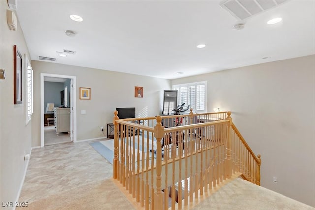 stairway featuring recessed lighting, visible vents, and baseboards