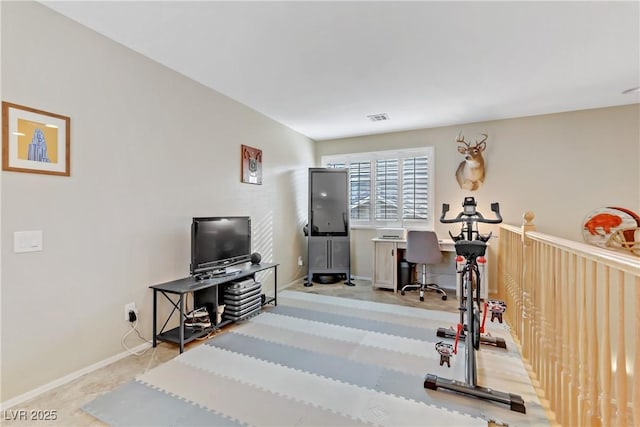 workout area with light carpet, visible vents, and baseboards