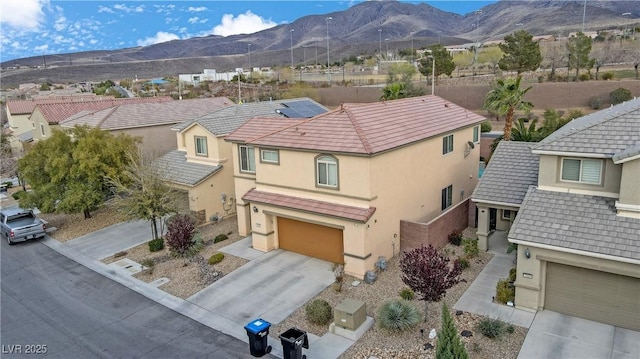 drone / aerial view featuring a residential view and a mountain view