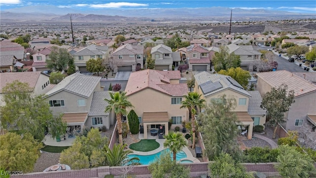 aerial view featuring a mountain view and a residential view