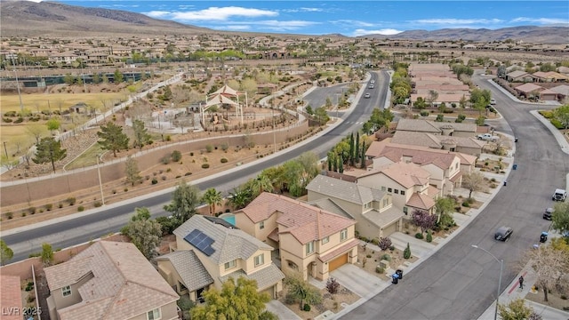 birds eye view of property with a mountain view and a residential view