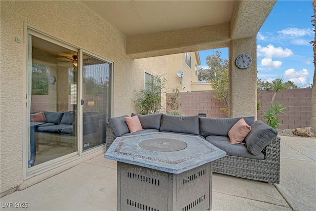 view of patio with an outdoor hangout area and fence