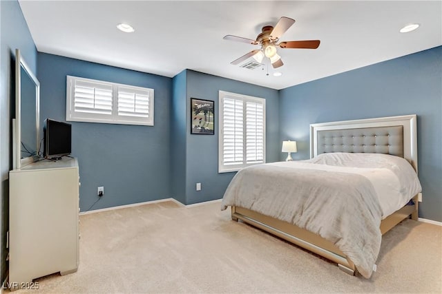 carpeted bedroom featuring recessed lighting, visible vents, baseboards, and a ceiling fan