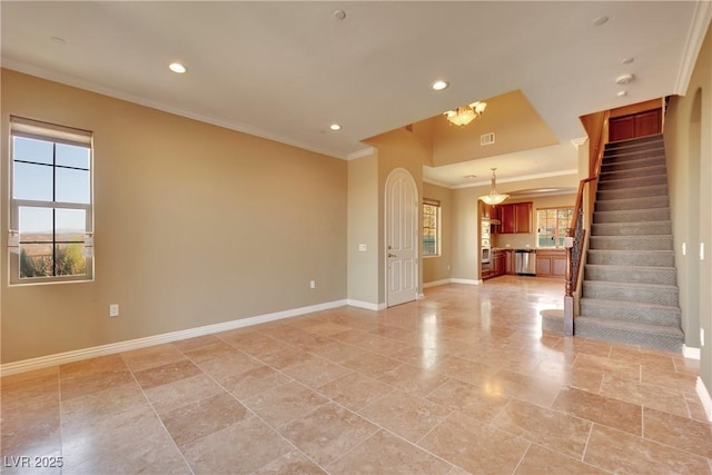 unfurnished living room featuring stairway, baseboards, a healthy amount of sunlight, and ornamental molding