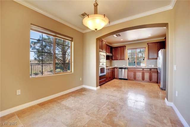 kitchen with visible vents, arched walkways, backsplash, and appliances with stainless steel finishes