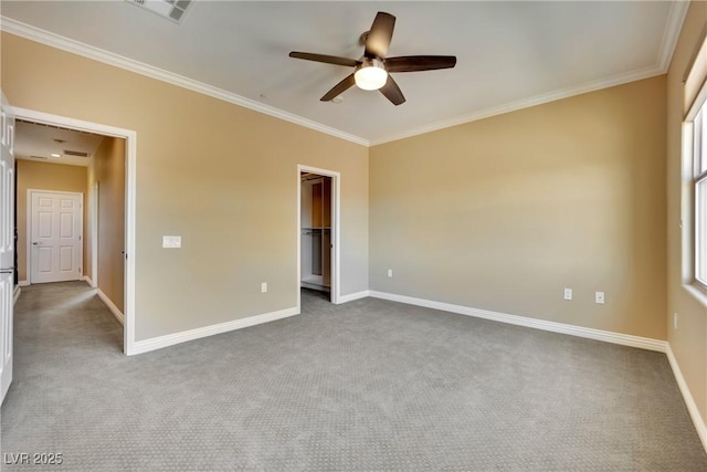 unfurnished bedroom featuring visible vents, carpet flooring, crown molding, baseboards, and ceiling fan