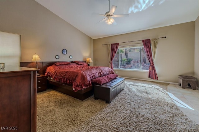 bedroom with vaulted ceiling, baseboards, tile patterned floors, and ceiling fan