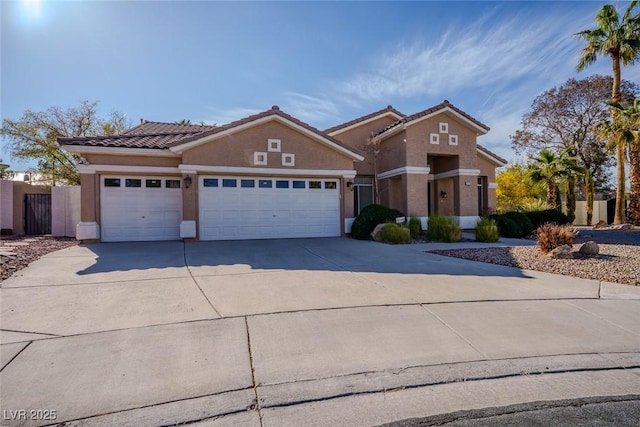 view of front of house featuring stucco siding, concrete driveway, an attached garage, and a tiled roof