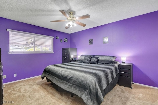 bedroom featuring baseboards, carpet, ceiling fan, and a textured ceiling