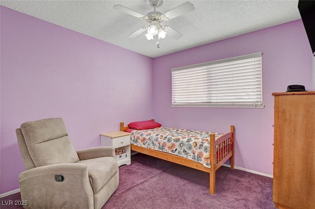 carpeted bedroom with baseboards, a textured ceiling, and ceiling fan