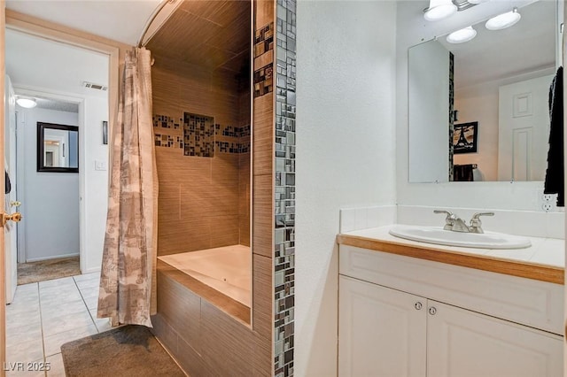 full bath featuring vanity, tile patterned floors, shower / bath combination with curtain, and visible vents