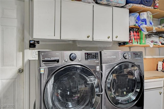 laundry area featuring cabinet space and washing machine and dryer