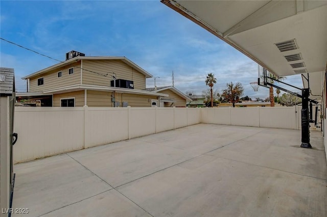 view of patio featuring fence