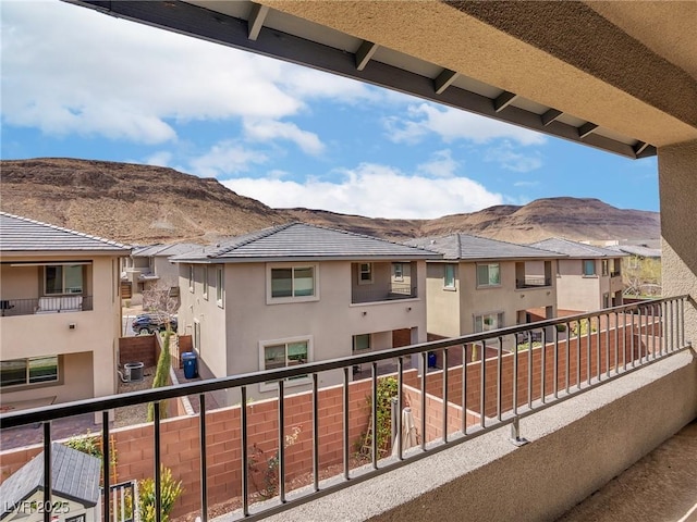 balcony with a mountain view and a residential view