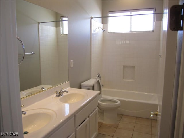 bathroom featuring a sink, toilet, and tile patterned floors