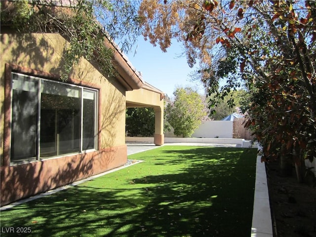 view of yard featuring fence