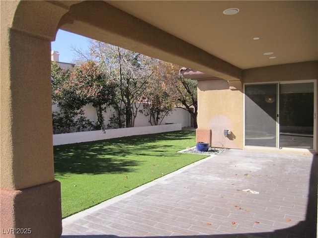 view of patio / terrace featuring fence