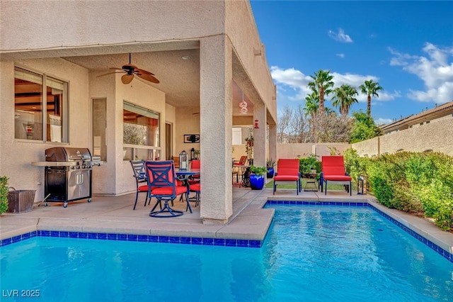 view of pool with a patio, a fenced in pool, a fenced backyard, ceiling fan, and a grill