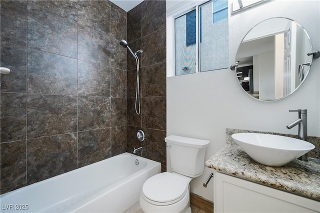 full bath featuring toilet, tub / shower combination, and vanity