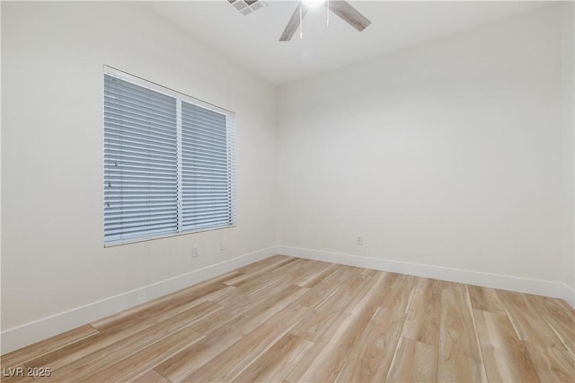 unfurnished room with visible vents, ceiling fan, baseboards, and light wood-style floors