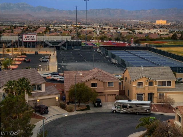 birds eye view of property featuring a mountain view