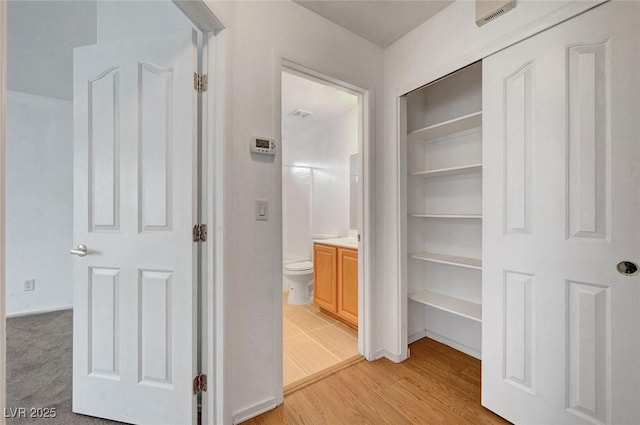 hallway with light wood-type flooring