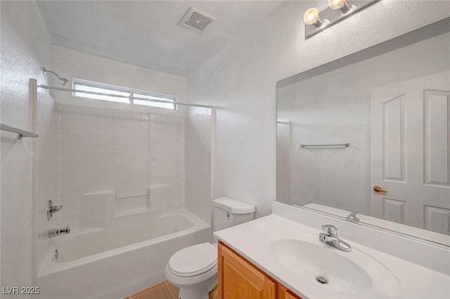 bathroom with visible vents, vanity, toilet, and shower / bathtub combination