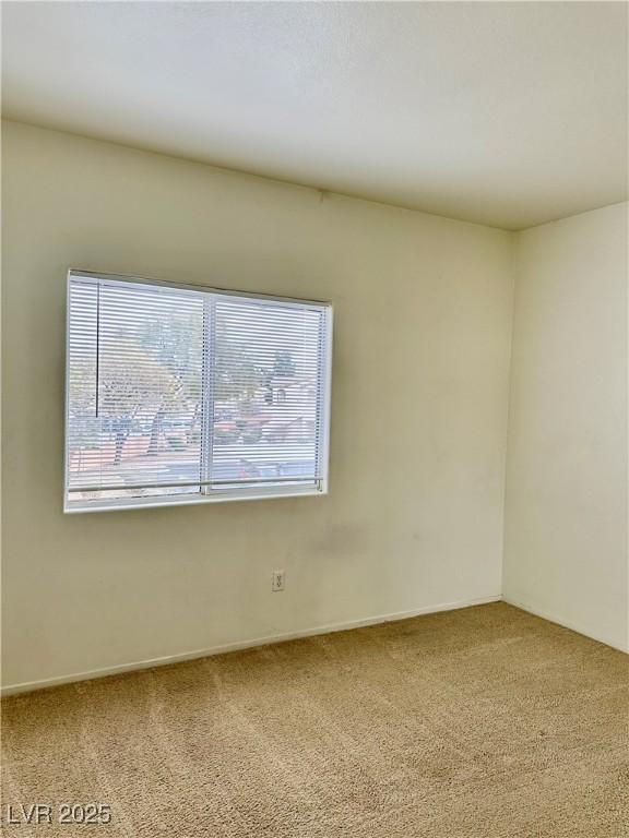 unfurnished room featuring carpet floors