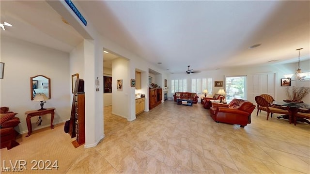 living area featuring a ceiling fan