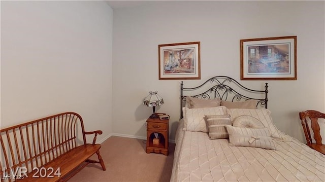 bedroom with baseboards and carpet flooring