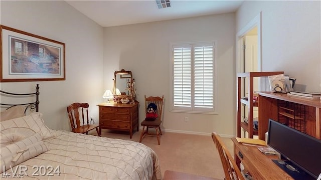 bedroom with carpet, visible vents, and baseboards