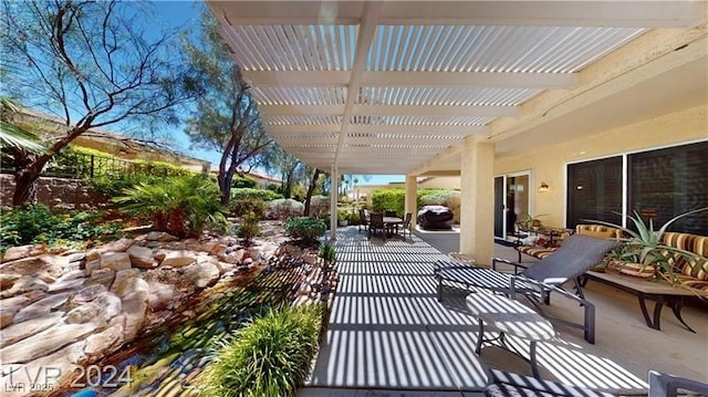 view of patio / terrace with outdoor dining space and a pergola