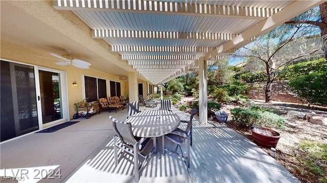 view of patio with outdoor dining space, a ceiling fan, and a pergola