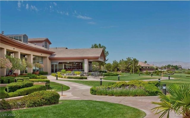 view of home's community with a lawn