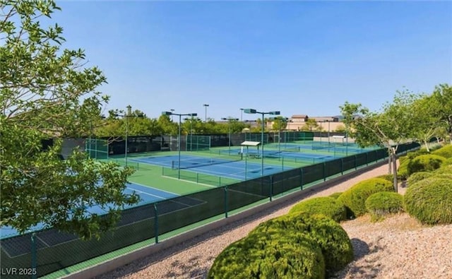 view of sport court featuring fence